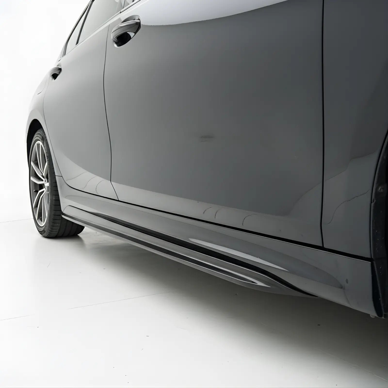 Side view of a  BMW 3 Series G20 Side Skirts for M-Sport on a white background with 'LD' logo.