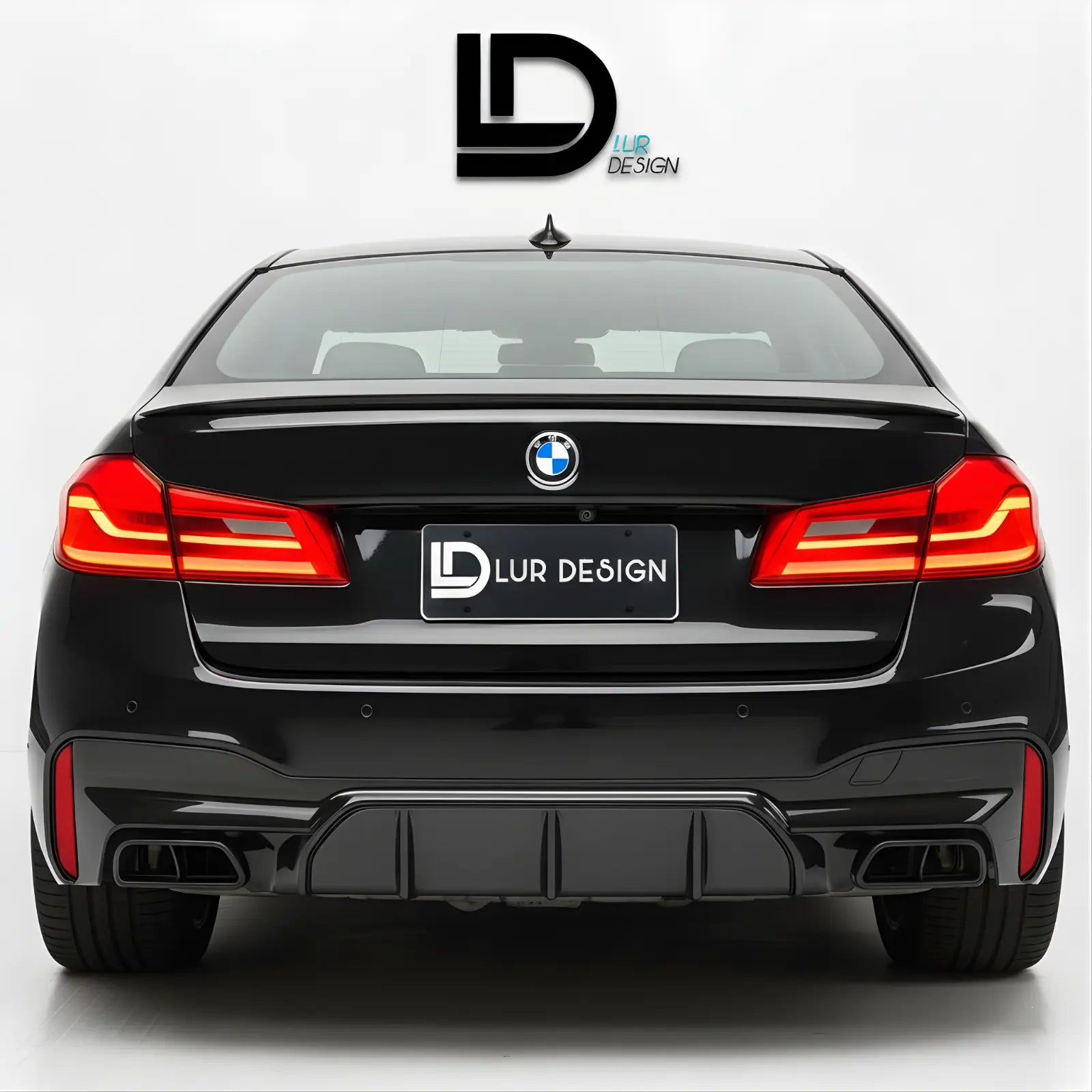 BMW 5 series G30 with Lur Design rear bumper Diffuser valance on a white background
