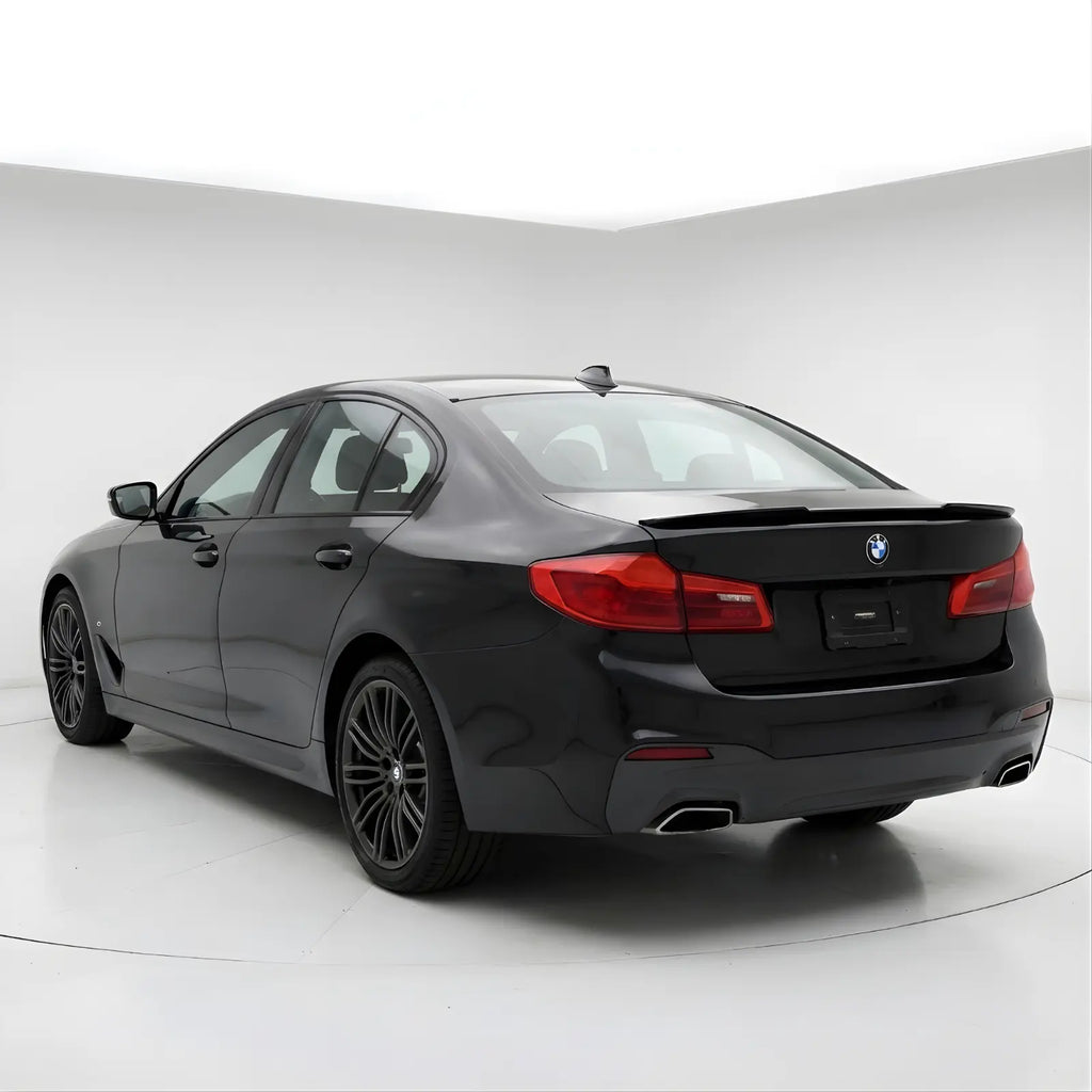 BMW_Series_5_g30_spoiler_2 duckbill spoiler lip
Black BMW car on a white background