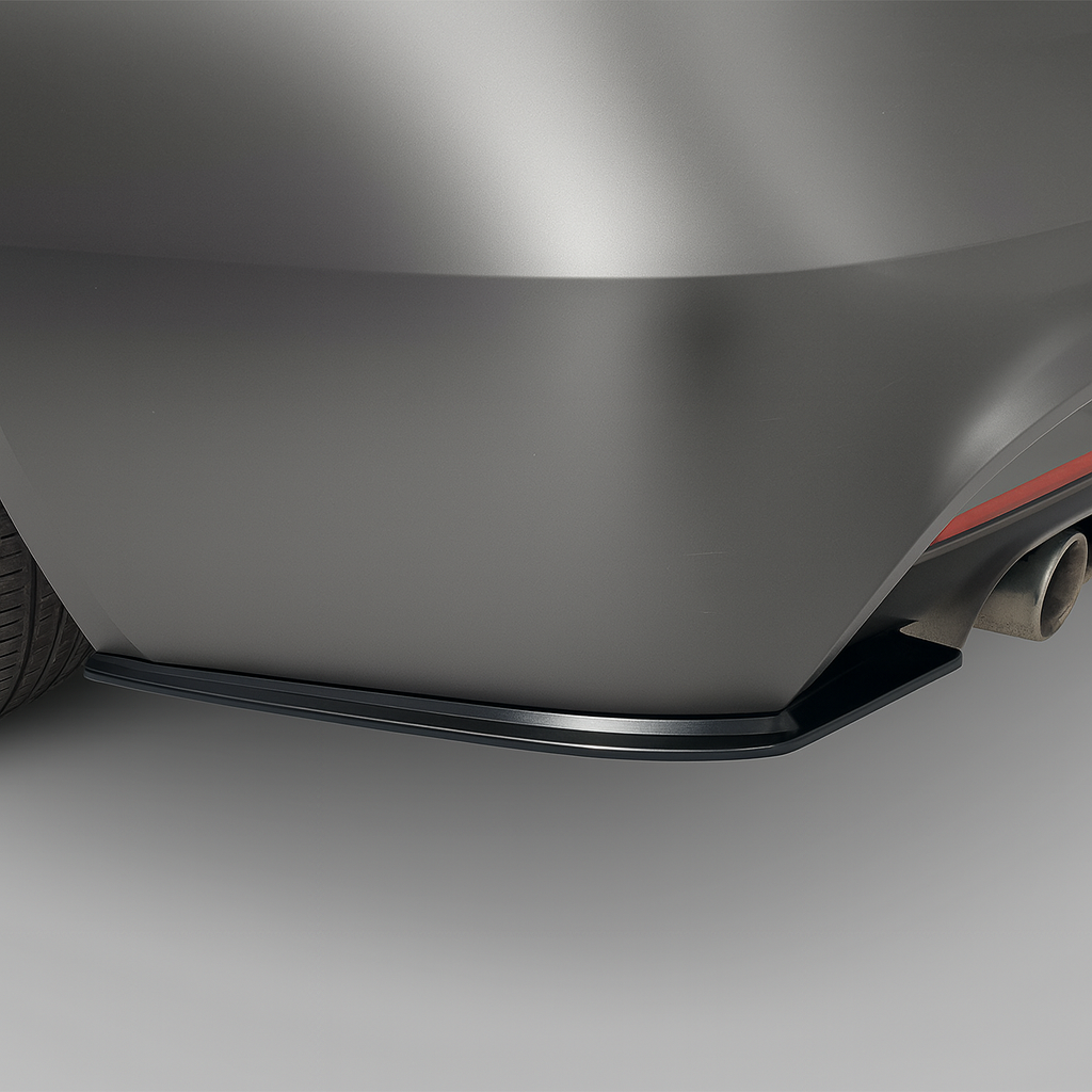 Close-up of a car's rear side splitters on a gray background