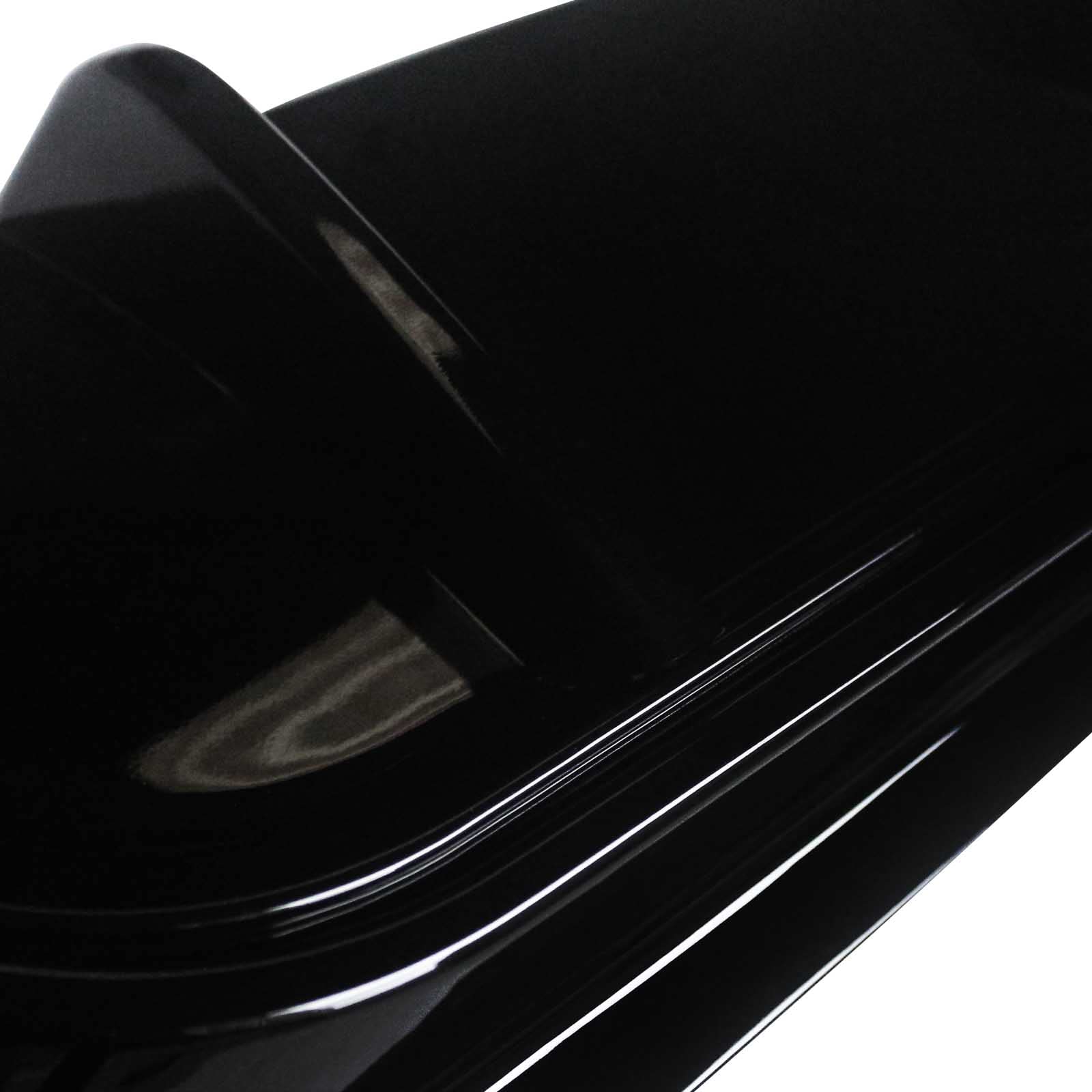 Close-up of a glossy black Car bumper rear Diffuser
