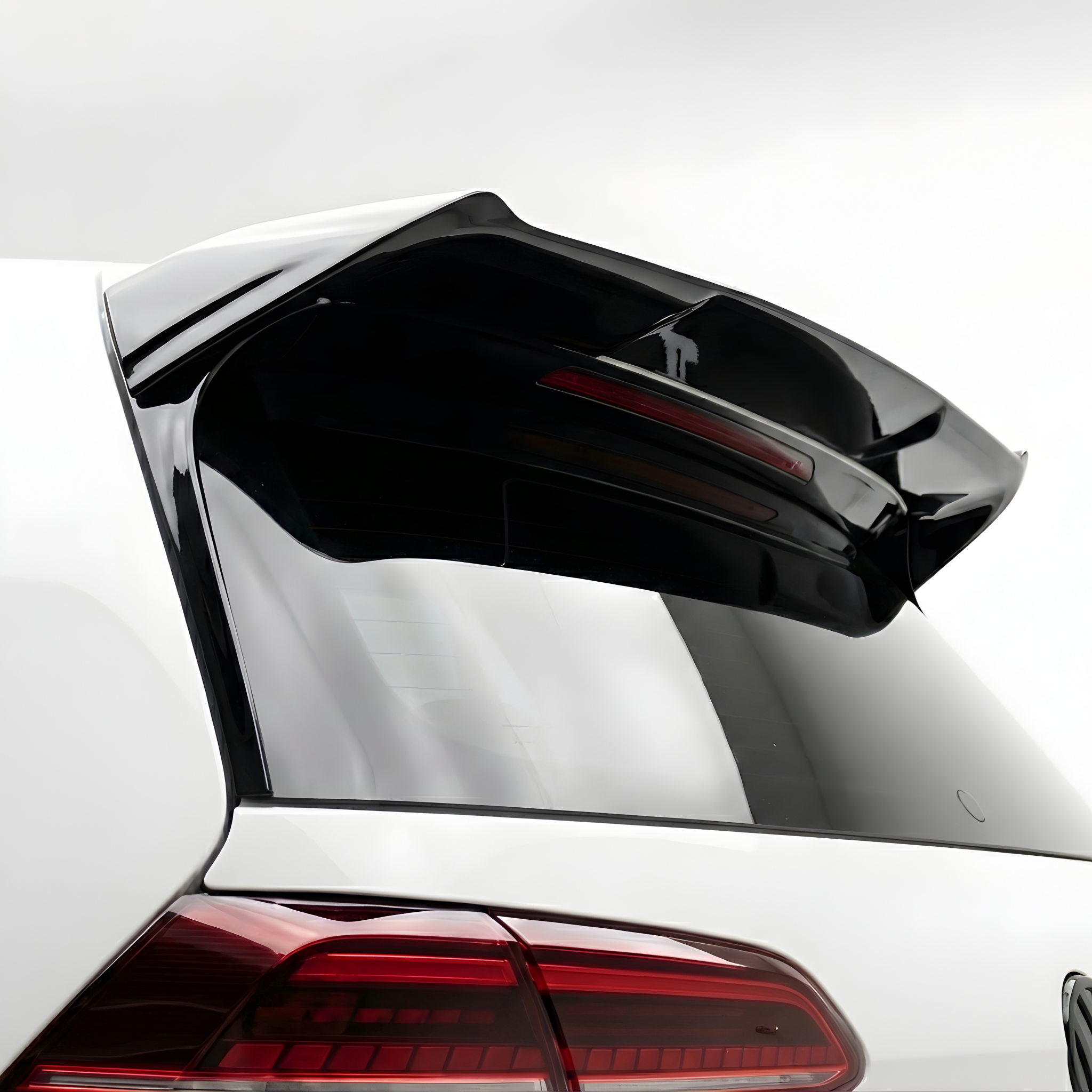 V2 Rear Spoiler for Volkwagen Golf 7/7.5 / GTI / R
Close-up of a black car's rear wing/spoiler with a logo in the background