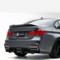 bmw_5_series_with a black rear spoiler on a white background