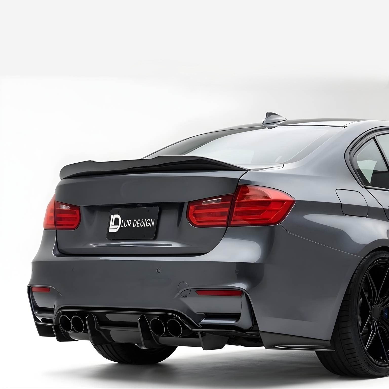 bmw_5_series_with a black rear spoiler on a white background